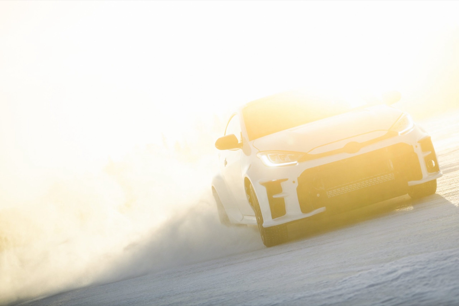 Zero Degrees GR Yaris emerging from golden mist on the frozen lake
